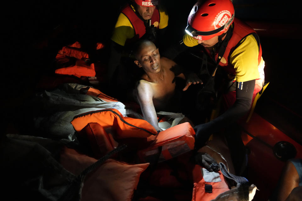 A migrant is rescued by members of the Spanish NGO Open Arms during a rescue operation in the Mediterranean sea early Sunday, Sept. 18, 2022. Around 200 migrants from Syria and Africa countries were rescued by NGO Open Arms crew members. (AP Photo/Petros Karadjias)