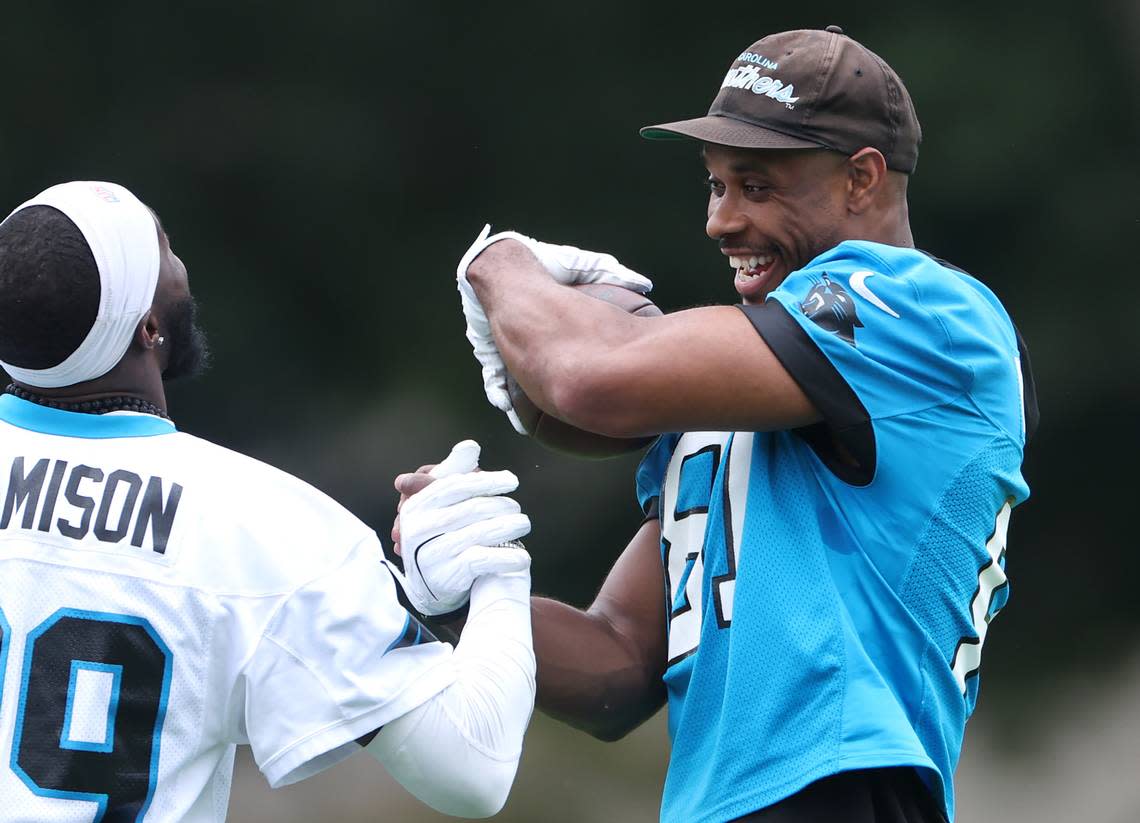 Carolina Panthers cornerback D’Shawn Jamison, left and tight end Jordan Matthews, right, joke around prior to training camp practice on Thursday, July 25, 2024.