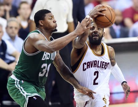 May 23, 2017; Cleveland, OH, USA; Cleveland Cavaliers guard Kyrie Irving (2) drives to the basket against Boston Celtics guard Marcus Smart (36) during the second half in game four of the Eastern conference finals of the NBA Playoffs at Quicken Loans Arena. Mandatory Credit: Ken Blaze-USA TODAY Sports