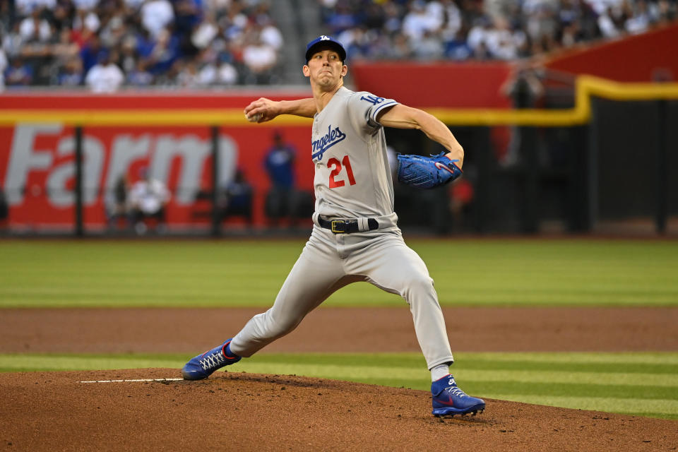 PHOENIX, ARIZONA - APRIL 25: Walker Buehler #21 of the Los Angeles Dodgers delivers a first inning pitch against the Arizona Diamondbacks at Chase Field on April 25, 2022 in Phoenix, Arizona. (Photo by Norm Hall/Getty Images)