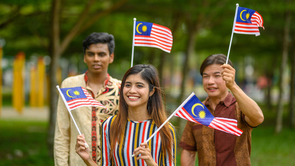 Malaysians waving flags