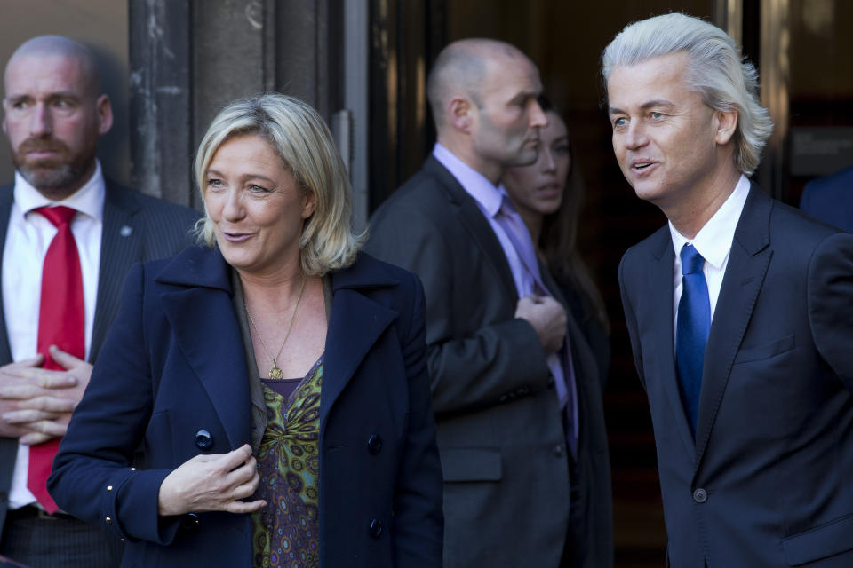 FILE - European right-wing politicians Dutchman Geert Wilders, right, and France's Marine Le Pen, left, pose for photographers in The Hague, Wednesday Nov. 13, 2013. Geert Wilders has won a massive victory in a Dutch election and is in pole position to form the next governing coalition and possibly become the Netherlands' next prime minister. (AP Photo/Peter Dejong, File)