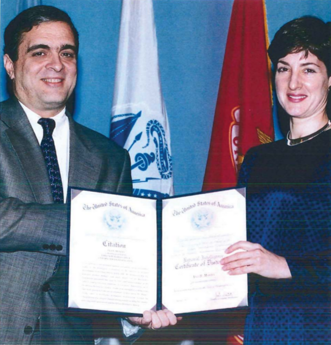 Ana Belén Montes receives the National Intelligence Certificate of Distinction from then-deputy Director of Central Intelligence George Tenet on 21 February 1997.