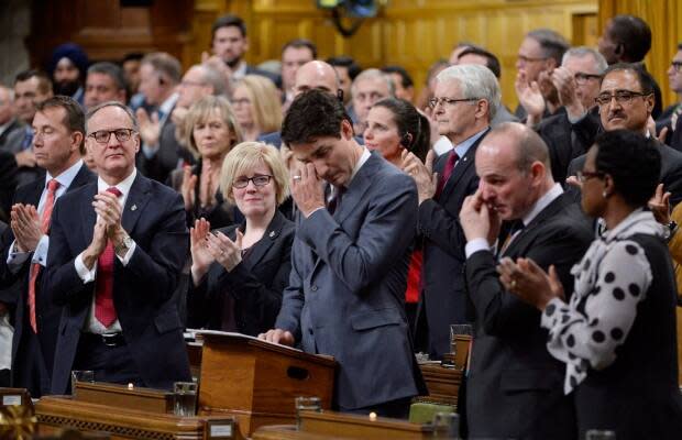 Prime Minister Justin Trudeau wipes his eye as he delivers a formal apology to LGBTQ people in Canada in the House of Commons in Ottawa, Tuesday, Nov. 28, 2017. 