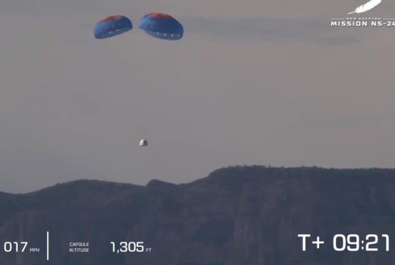 The capsule returns to the ground after the 24th mission of Blue Origin's New Shepard suborbital rocket in West Texas on Tuesday. Screenshot via Blue Origin