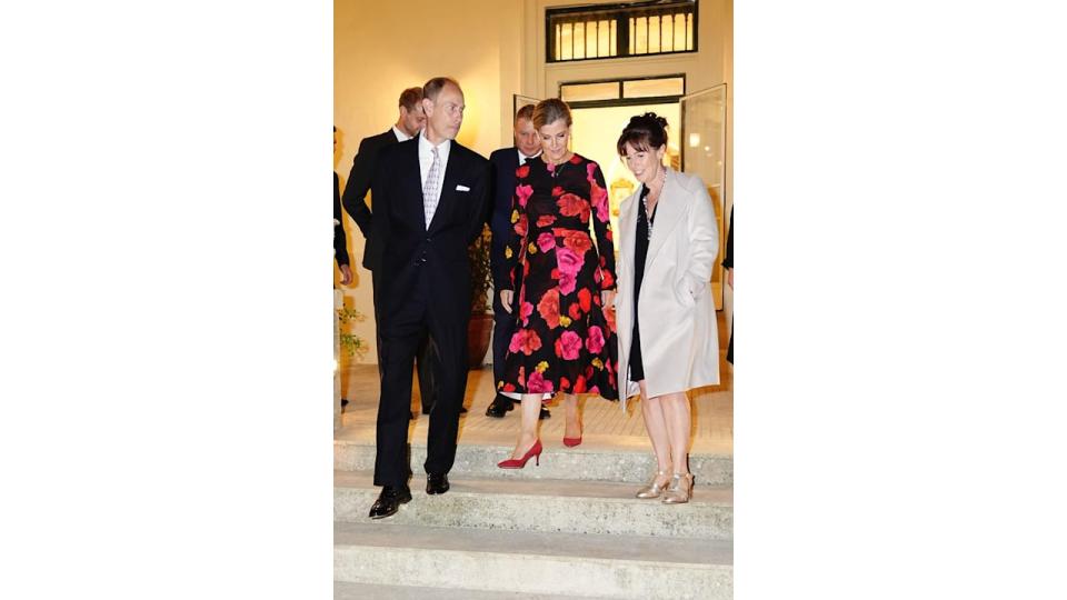 The Duchess of Edinburgh in ruby slippers and red rose dress