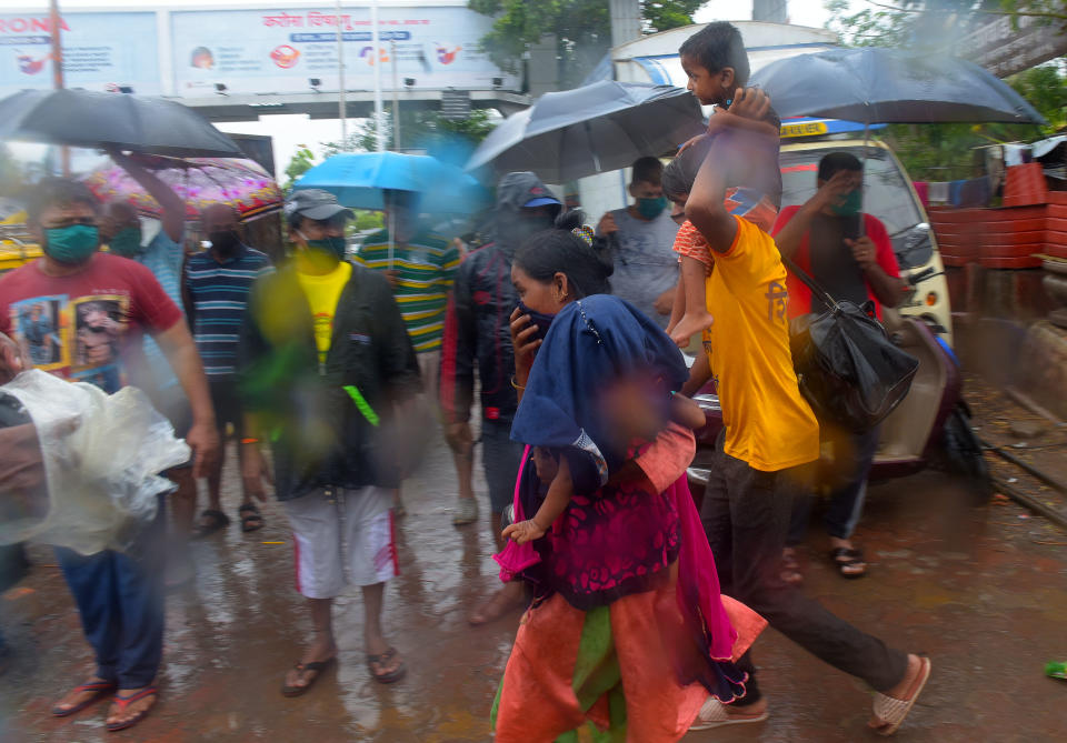 MUMBAI, INDIA - JUNE 3: Residence of pattharwadi near mahim Koliwada sea shore shifted to New BMC School mahim due to Nisarga cyclone on June 3, 2020 in Mumbai, India. Alibaug witnessed wind speeds of up to 120 kilometres per hour. Although the cyclone made the landfall just 95 kilometres from Mumbai, the Maharashtra capital largely escaped its wrath. (Photo by Vijayanand Gupta/Hindustan Times via Getty Images)