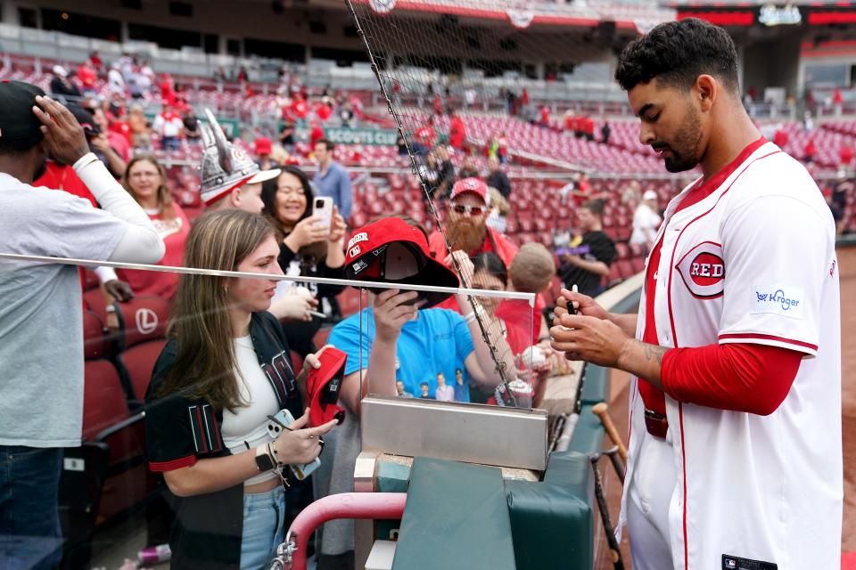 Christian Encarnacion-Strand wasn't done making Reds fans happy after his walk-off home run Sunday evening, taking the time to sign autographs for some who stuck around after the celebration.