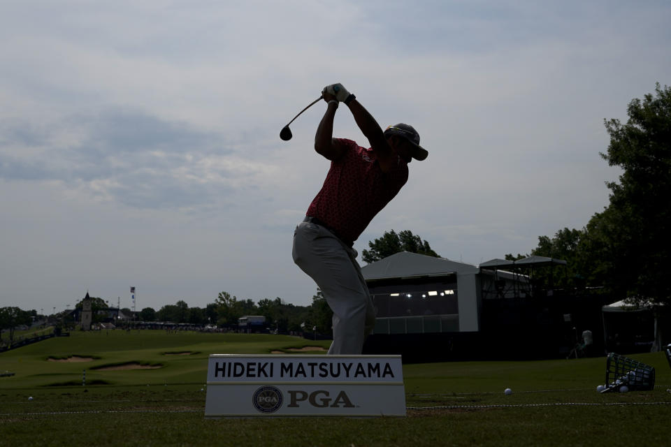 Hideki Matsuyama, of Japan, warms up on the driving range before a practice round for the PGA Championship golf tournament, Tuesday, May 17, 2022, in Tulsa, Okla. (AP Photo/Eric Gay)