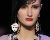 <b>Armani Prive SS13</b> <br><br>Cute, doll-face earrings made accessories the key look on this model.<br><br>©Reuters