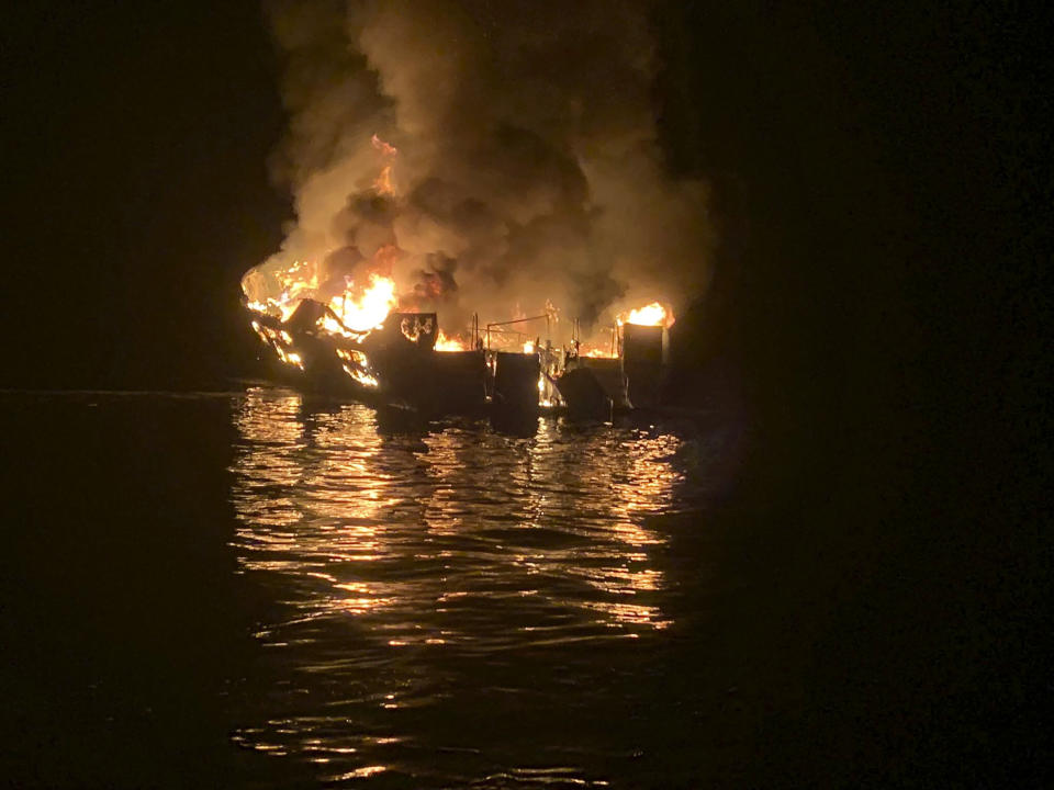 In this photo provided by the Santa Barbara County Fire Department, a dive boat is engulfed in flames after a deadly fire broke out aboard the commercial scuba diving vessel off the Southern California Coast, Monday morning, Sept. 2, 2019. (Santa Barbara County Fire Department via AP)