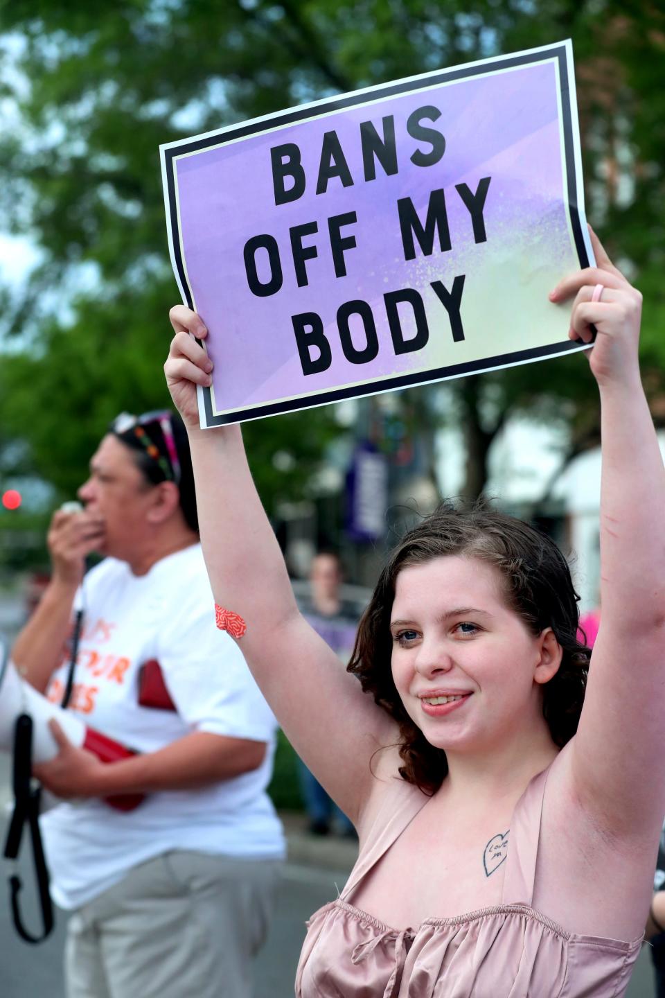 Nice Bartley, holds a sign as she demonstrates against an leaked opinion from the U.S. Supreme Court that could possibly overturn Roe vs. Wade, and reverse legalized abortions in the US. in Murfreesboro on Tuesday, May 3, 2022, as Darlene Neal demonstrates over a megaphone in the background.