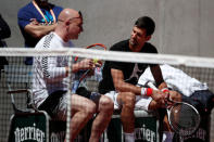 Tennis - French Open - Roland Garros - Paris - 25/05/2017. Novak Djokovic of Serbia and his coach Andre Agassi during a training session. REUTERS/Benoit Tessier