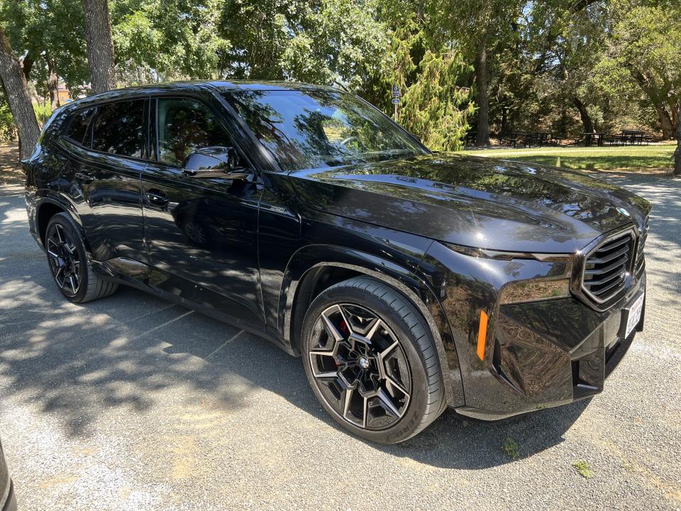 The BMW XM sport activity vehicle is pictured on a driveway.