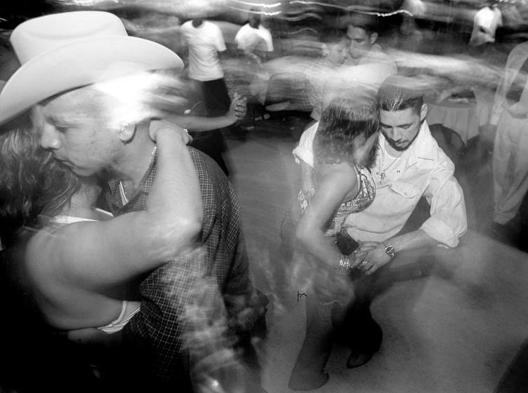 Couples dance at La Zona Rosa dancing club on Cesar Chavez Avenue.