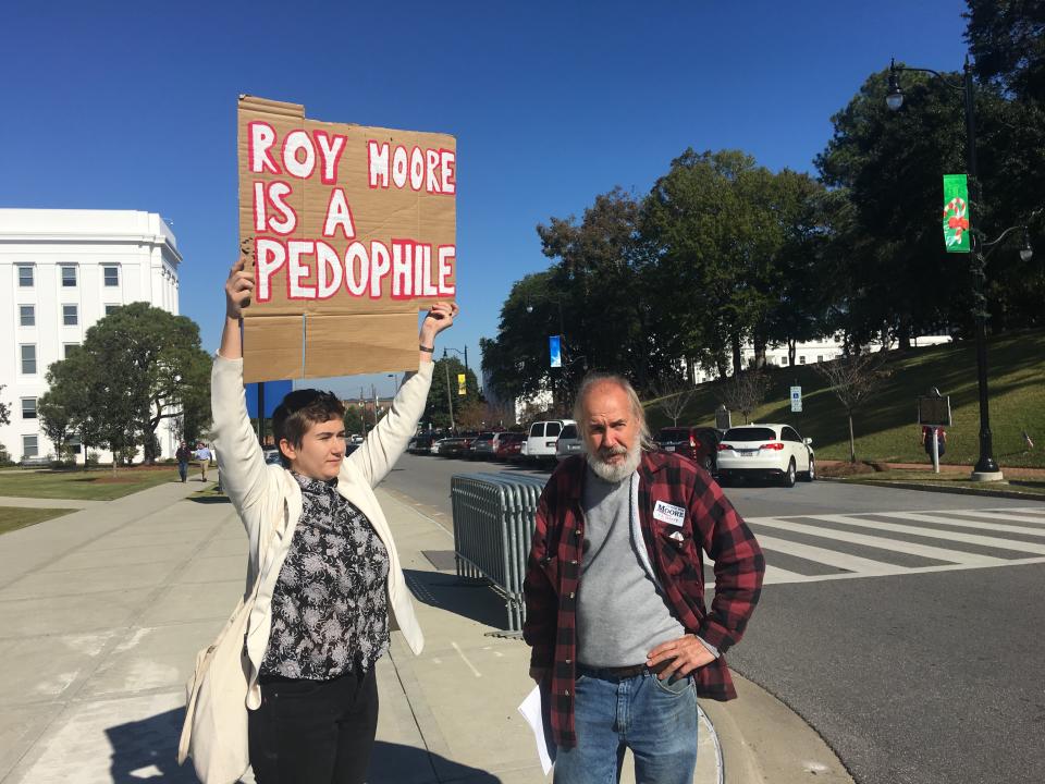 Tim Hensley, at right, argues with a protester at the Roy Moore event on Friday. (Photo: Andy Campbell/HuffPost)