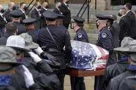 Pallbearers from the U.S. Capitol Police, center, carry the casket of William "Billy" Evans into St. Stanislaus Kostka Church before a funeral Mass, Thursday, April 15, 2021, in Adams, Mass. Evans, a member of the U.S. Capitol Police, was killed on Friday, April 2, when a driver slammed his car into a checkpoint he was guarding at the Capitol. (AP Photo/Steven Senne)