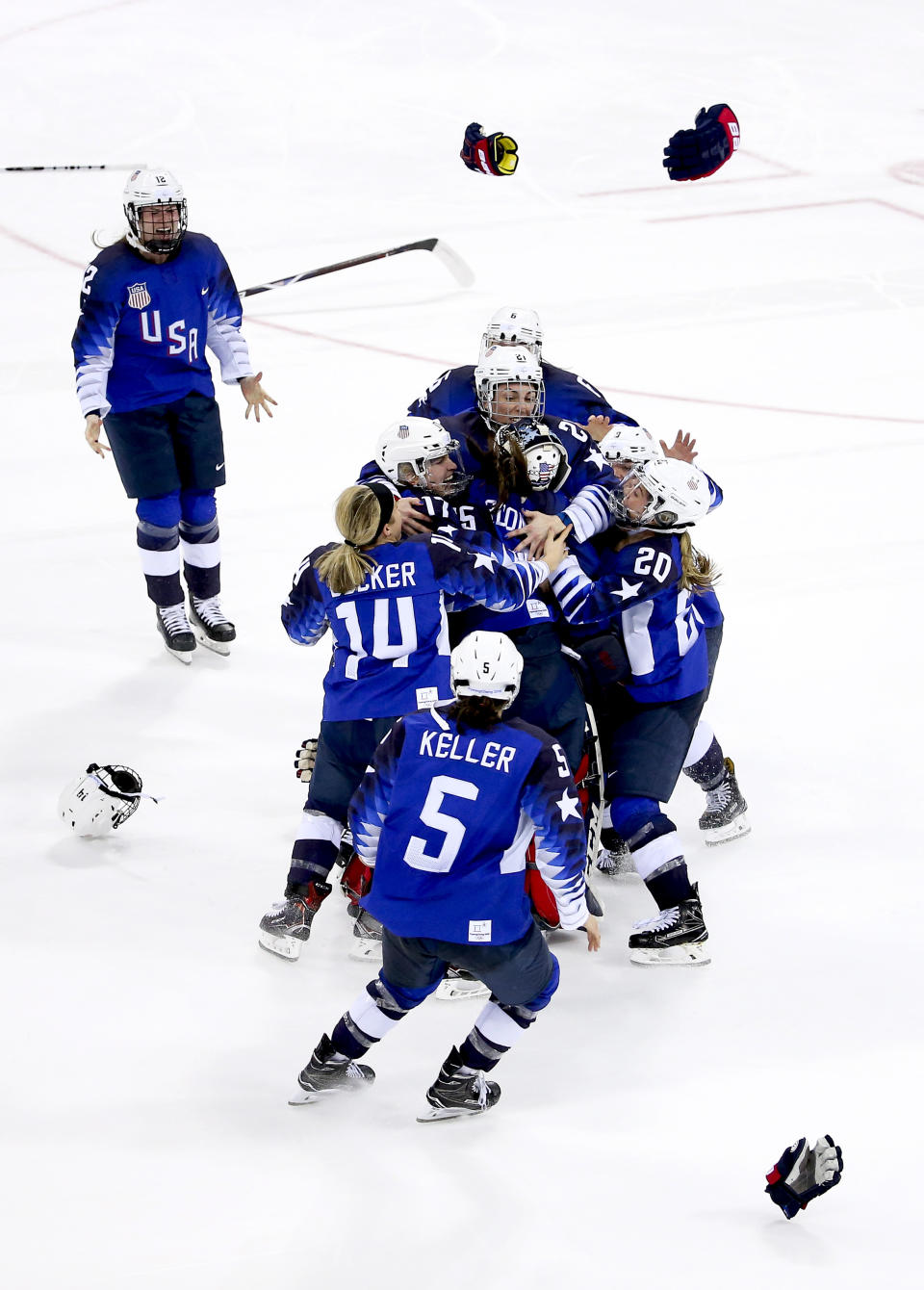 <p>Players of Team USA celebrate winning the gold medal following the Women’s Ice Hockey Gold Medal game final between USA and Canada at the PyeongChang 2018 Winter Olympic Games in South Korea, February 22, 2018.<br> (Photo by Jean Catuffe/Getty Images) </p>