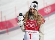 Snowboarding - Pyeongchang 2018 Winter Olympics - Women's Big Air Final Run 3 - Alpensia Ski Jumping Centre - Pyeongchang, South Korea - February 22, 2018 - Gold medallist Anna Gasser of Austria holds a Soohorang Olympics plush mascot during the flower ceremony. REUTERS/Kim Hong-Ji