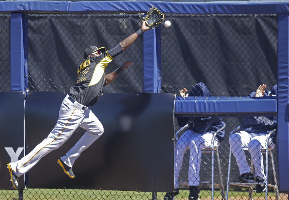 Pittsburgh Pirates right fielder Gregory Polanco (62) chases the ball on a triple hit by Tampa Bay Rays Logan Forsythe in the first inning of a exhibition baseball game in Port Charlotte, Fla., Saturday, March 8, 2014. (AP Photo/Gerald Herbert)