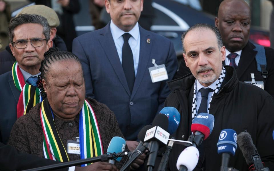 South Africa's Foreign Minister Naledi Pandor, left, addresses reporters after the International Court of Justice ruling