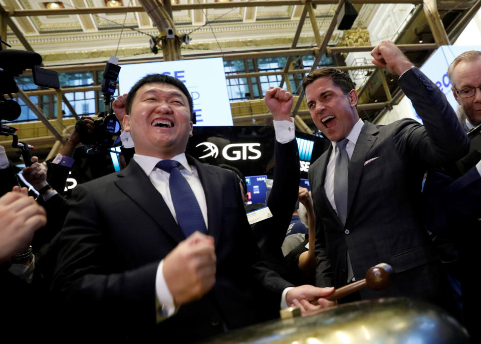 Singapore-based Sea Limited Chairman and CEO Forrest Li rings the ceremonial bell to celebrate his company's IPO on the floor of the New York Stock Exchange (NYSE) in New York, U.S., October 20, 2017. REUTERS/Brendan McDermid