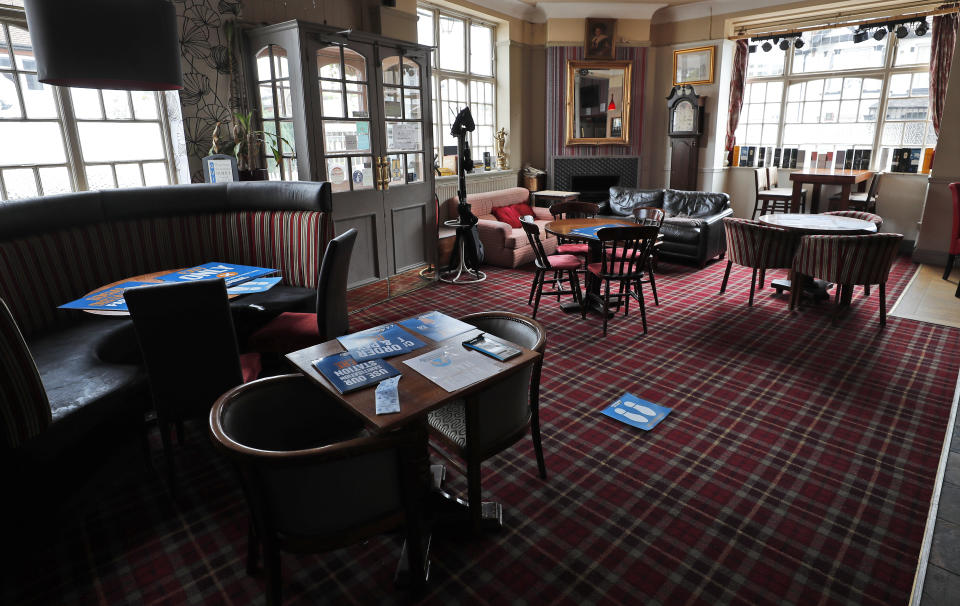 Tables are arranged for social distancing at the Chandos Arms pub in London, Wednesday, July 1, 2020. Asking people in English pubs to keep their distance is going to be tough after they’ve had a few of their favorite tipples. Pub managers will have to be resourceful come Saturday, July 4, 2020, when they and other parts of the hospitality industry in England open their doors to customers for the first time since March 20, provided they meet COVID safety requirements. (AP Photo/Frank Augstein)