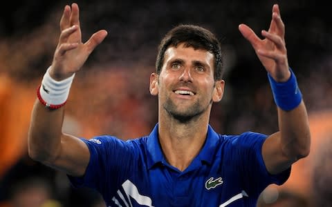 Serbia's Novak Djokovic celebrates after defeating Spain's Rafael Nadal in the men's singles final at this year's Australian Open - Credit: AP