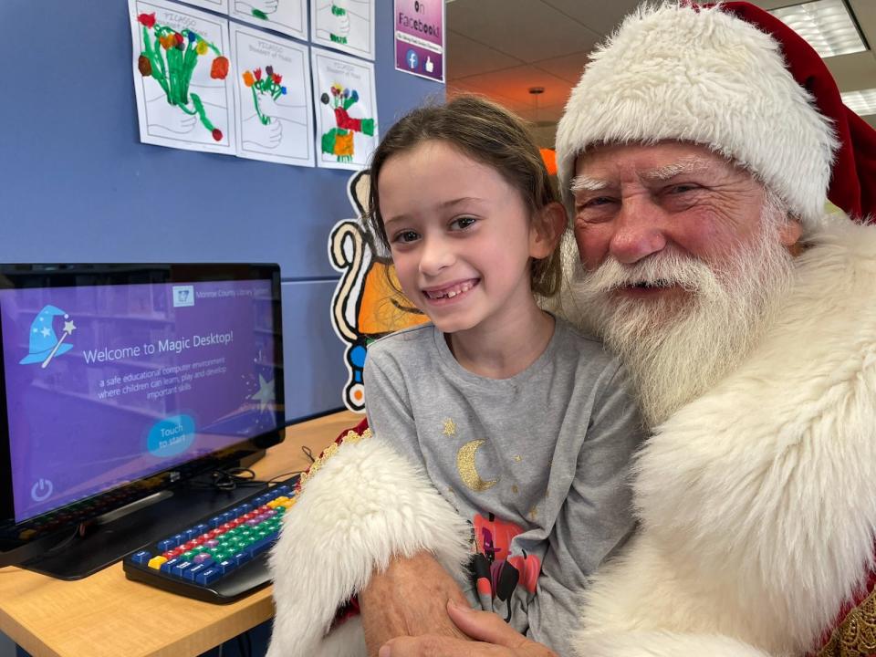 Audrey Johnson, 7, was awestruck Sept. 7 when she unexpectedly encountered first-time author Santa Claus (a.k.a. Stan Rogers) as he was doing research in the children's section at the Ellis Library and Research Center branch of the Monroe County Library System. Audrey's parents are Jennifer and Paul Johnson of Newport.