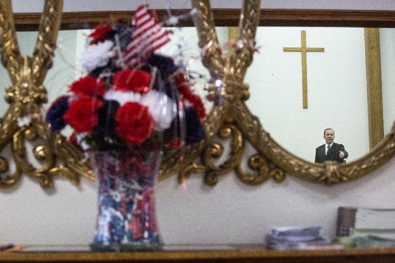 Pastor Robert Sperbeck delivers a sermon during a memorial service for the victims and families affected by the Fort Hood Shooting at the Tabernacle Baptist Church on Sunday, April 6, 2014, in Killeen, Texas. On April 2, 2014, three people were killed and 16 were wounded when a gunman opened fire before taking his own life at the Fort Hood military base. (AP Photo/ Tamir Kalifa)