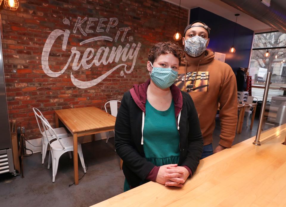 Darryl Goodner, right, co-owner of Louisville Cream, and manager Kelly Nusz in the NuLu district of Louisville, Ky. on Jan. 25, 2021.   They co-host the Butter Pecan podcast about the connection between racism and food.