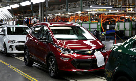 A red 2018 Chevrolet Bolt EV vehicle is seen on the assembly line at General Motors Orion Assembly in Lake Orion, Michigan, U.S., March 19, 2018. REUTERS/Rebecca Cook/Files