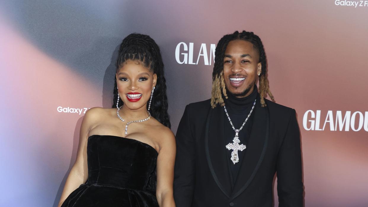 halle bailey and her boyfriend ddg smiling at a nevent