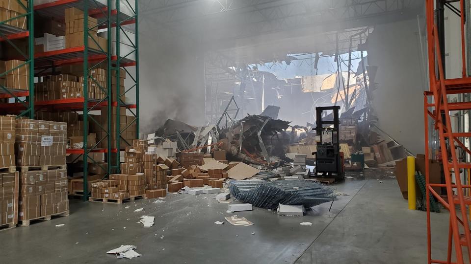 A photo of the inside of a warehouse in Riverside after an F-16 from March Air Reserve Base after it crashed into the warehouse Thursday afternoon.