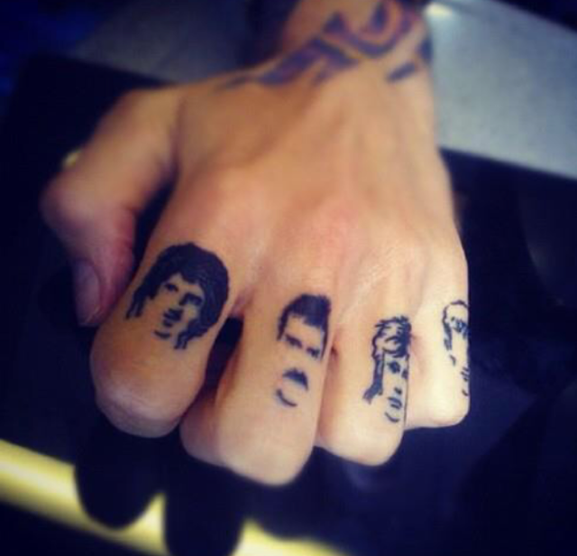 Justin Hawkins’s Queen knuckle tattoos. (Photo: Publicity Please)