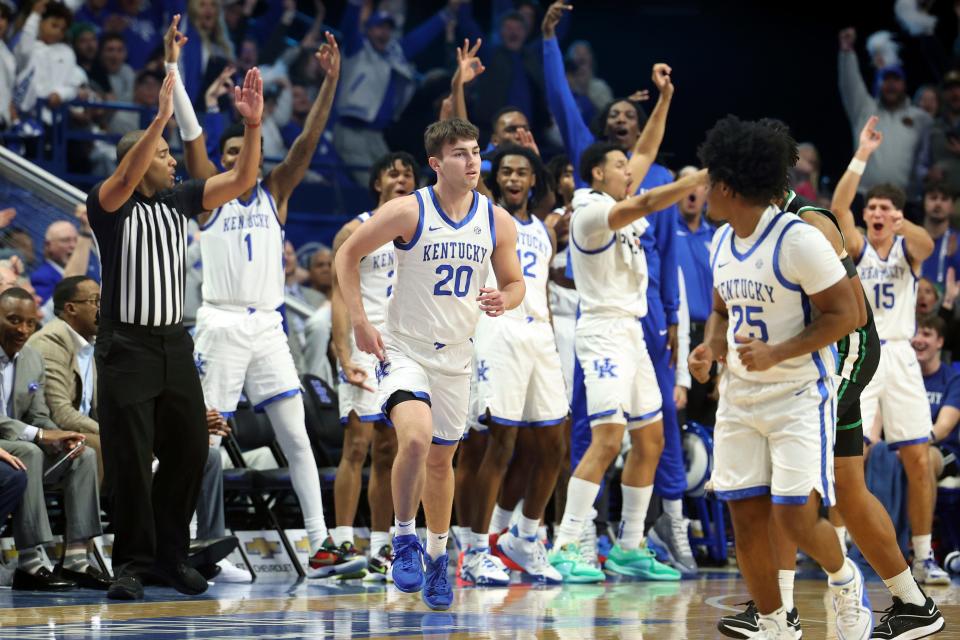 Kentucky's bench erupts after Joey Hart (20) hit a three point shot during the second half of an NCAA college basketball game against Marshall in Lexington, Ky., Friday, Nov. 24, 2023.