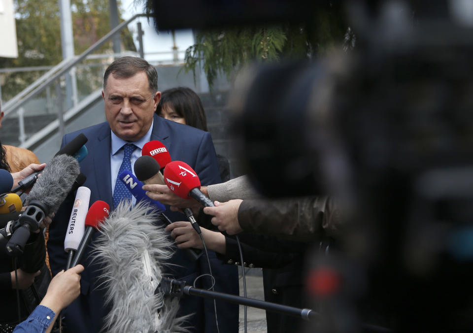 President of the Republic of Srpska Milorad Dodik speaks to journalists after voting in a general election in Laktasi, northwest of Sarajevo, Bosnia, Sunday, Oct. 7, 2018. Bosnians were voting Sunday in a general election that could install a pro-Russian nationalist to a top post and cement the ethnic divisions of a country that faced a brutal war 25 years ago. (AP Photo/Darko Vojinovic)