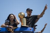 <p>Golden State Warriors guard Stephen Curry (30) waves to the crowd holding the championship trophy next to wife Ayesha Curry (left) during the Warriors 2017 championship victory parade in downtown Oakland. Mandatory Credit: Kyle Terada-USA TODAY Sports </p>