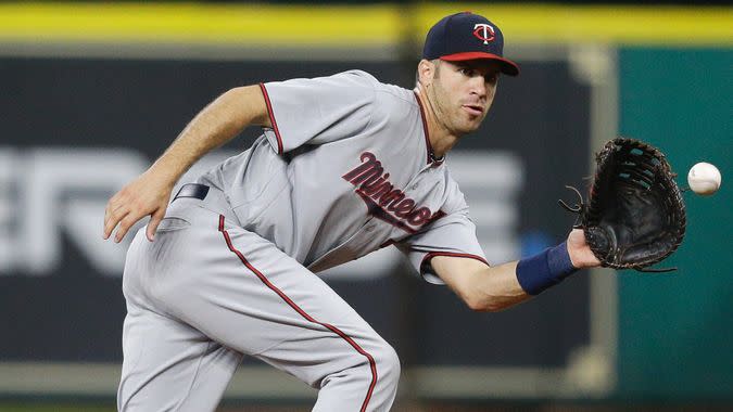 HOUSTON, TX - JULY 15:  Joe Mauer #7 of the Minnesota Twins makes a catch on a line drive by Josh Reddick #22 of the Houston Astros in the first inning at Minute Maid Park on July 15, 2017 in Houston, Texas.