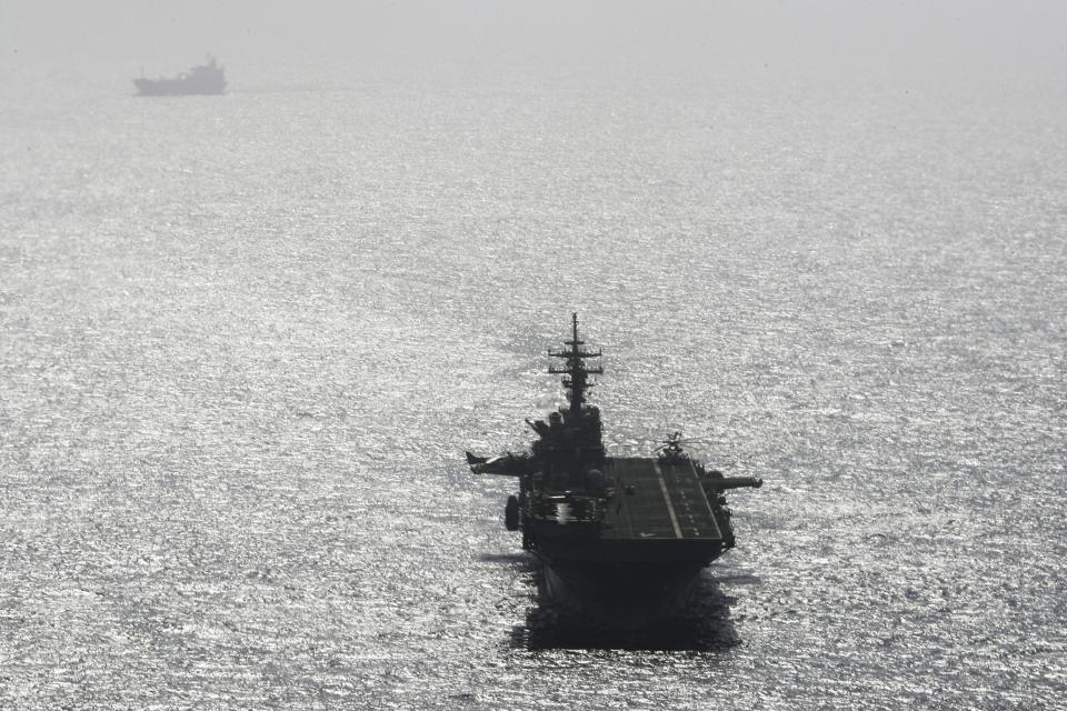 USS Boxer ship sails near a tanker in the Arabian Sea off Oman July 17, 2019. (REUTERS)