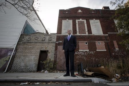 Alexander Sanger, Chair of the International Planned Parenthood Council poses for a photo outside of where his Grandmother Margaret Sanger opened the first birth control clinic 100 years ago, in the Brooklyn borough of New York, December 12, 2015. REUTERS/Carlo Allegri