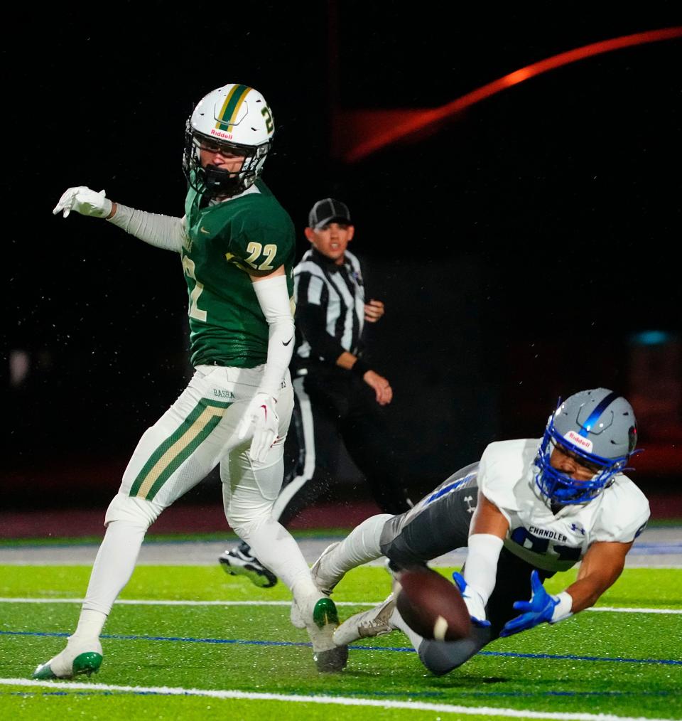 Chandler wideout Carter Ochoa (81) tries to dive and catch a pass in front of Basha defensive back Tommy Prassas (22) during the Open football semifinal at Dobson High School in Chandler on Dec. 3, 2022.