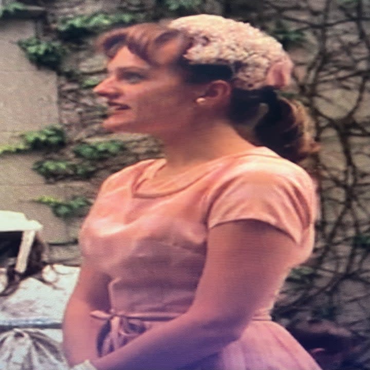 Elisabeth Moss wearing a pink dress in Mad Men