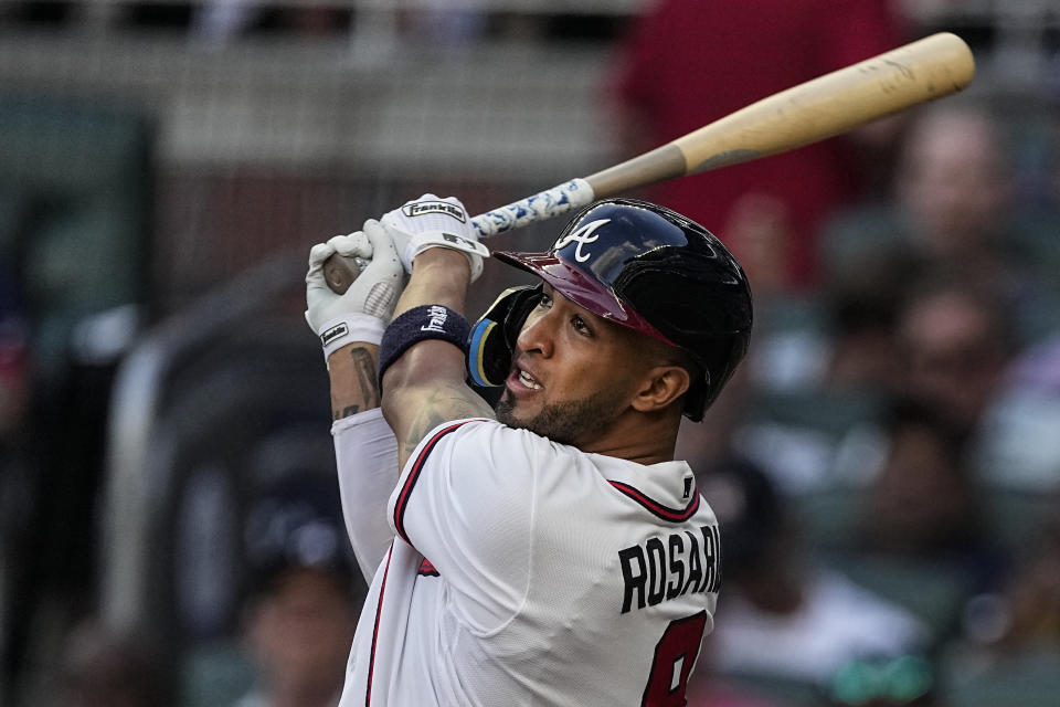 Atlanta Braves' Eddie Rosario watches his two-run home run against the New York Yankees during the second inning of a baseball game Wednesday, Aug. 16, 2023, in Atlanta. (AP Photo/John Bazemore)