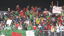 Bangladesh's fans watch the Cricket Twenty20 World Cup first round match between Bangladesh and Scotland in Muscat, Oman, Sunday, Oct. 17, 2021. (AP Photo/Kamran Jebreili)