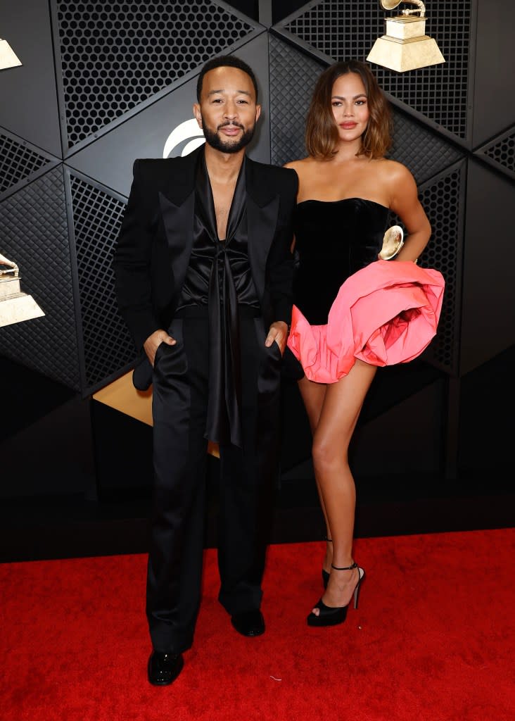 (L-R) John Legend and Chrissy Teigen attend the 66th GRAMMY Awards at Crypto.com Arena on February 04, 2024 in Los Angeles, California.