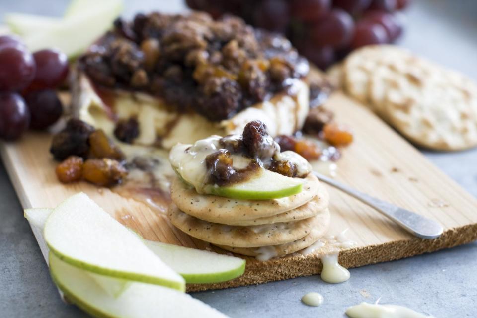 This April 1, 2013 photo taken in Concord, N.H. shows a recipe for cedar-planked pecan, bourbon and brown sugar glazed brie. (AP Photo/Matthew Mead)