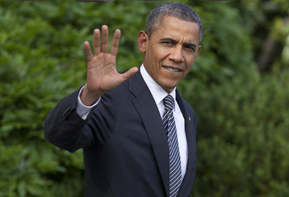 President Barack Obama waves as he walks from the White House in Washington, Friday, May 18, 2012, to board Marine One, as he travels to Camp David for the G8 Summit. (AP Photo/Carolyn Kaster)