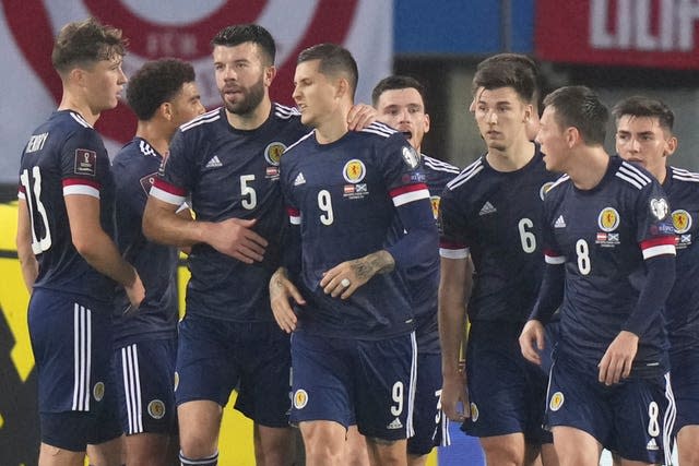 Lyndon Dykes, centre, celebrates his goal with his Scotland team-mates 