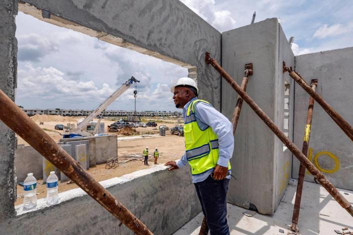 Factory manager Charles Gilbert of Onx, stands inside one of the prefabricated homes under construction June 1, 2023 at the Alba development in Homestead. Homestead remains a popular neighborhood for buyers looking to find affordable houses.